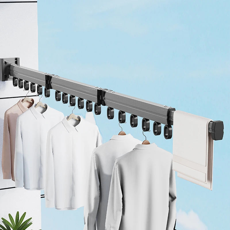 Retractable aluminum wall-mount drying rack for clothes and towels, foldable space-saving laundry hanger.
