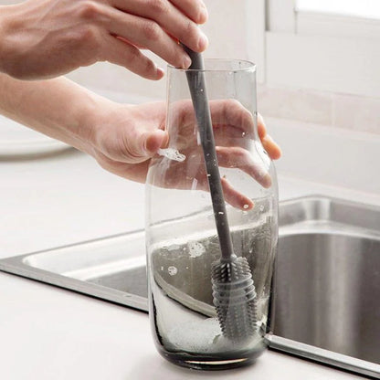 Silicone bottle brush with long handle for cleaning cups, glasses, and bottles, non-scratch bristles, durable kitchen cleaning tool.  
