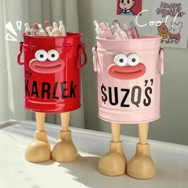 Cute cartoon pen holder with random letter stickers for organizing pens, pencils, and desk accessories at home or office.
