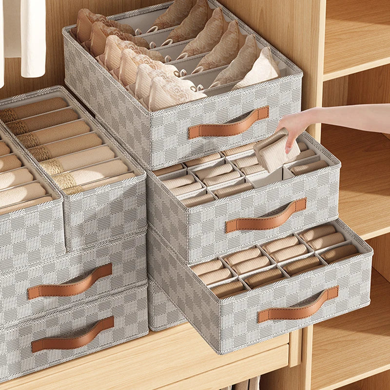 Foldable cloth underwear organizer with compartments for bras, socks, scarves, and clothing.
