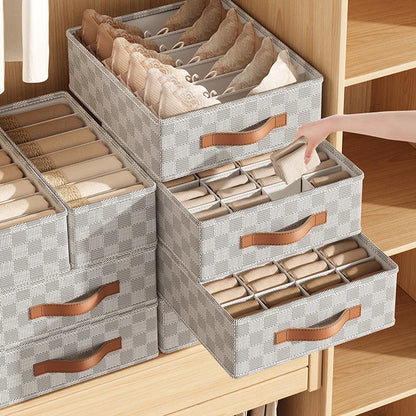 Foldable cloth underwear organizer with compartments for bras, socks, scarves, and clothing.
