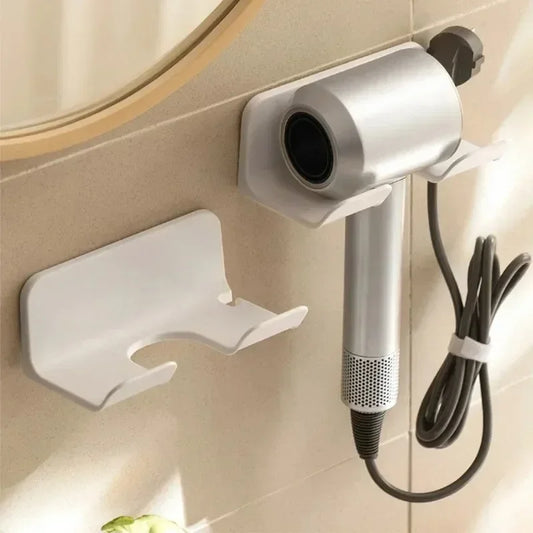 Wall-mounted hair dryer holder with punch-free design, ABS plastic construction, and sleek white/black finish for bathroom storage.  
