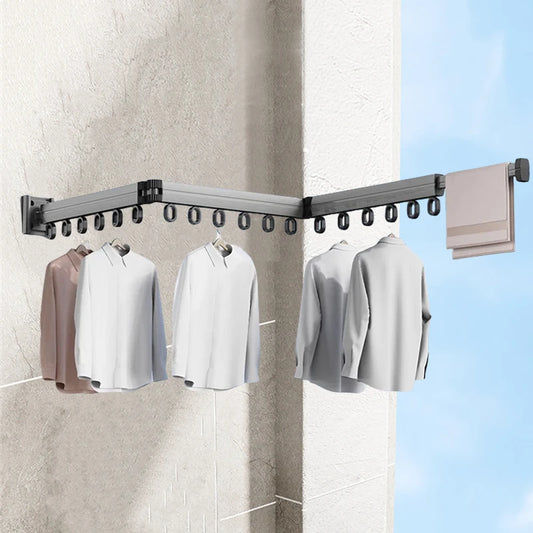 Retractable aluminum wall-mount drying rack for clothes and towels, foldable space-saving laundry hanger.

