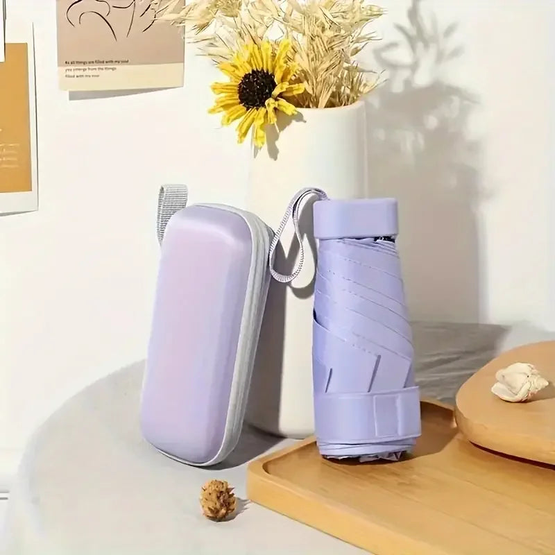 Portable ultra-light sixfold mini umbrella with UV-resistant canopy, foldable travel design for sun and rain protection
